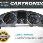 VW Phaeton instrument cluster dashboard with speedometer, tachometer, and digital display.